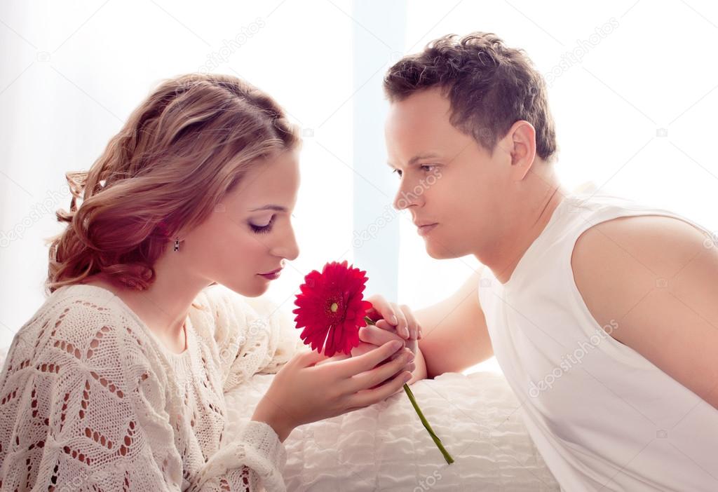 Man presents flower