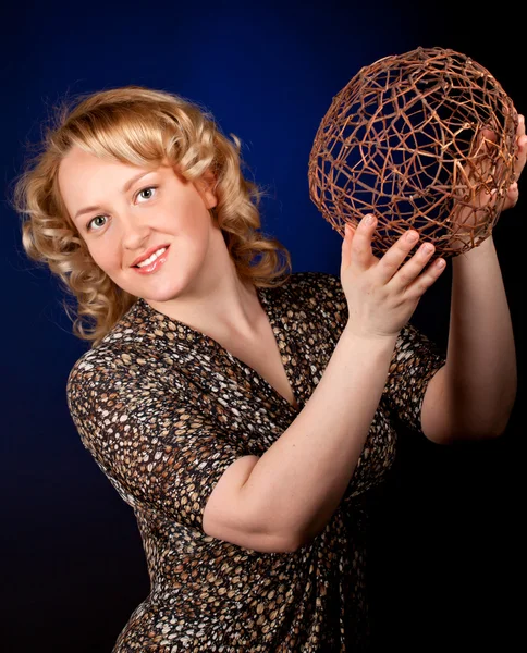 Portrait of a beautiful female model on dark background — Stock Photo, Image