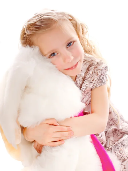 GIrl and boy wearing as Easter Rabbit sitting on the grass — Stock Photo, Image