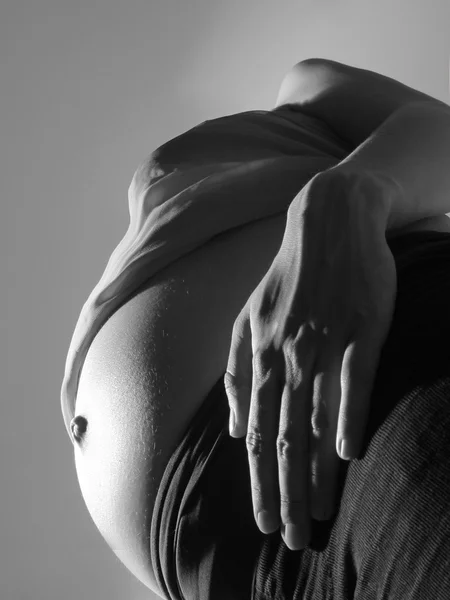 Close up of pregnant tummy as consept of maternity — Stock Photo, Image