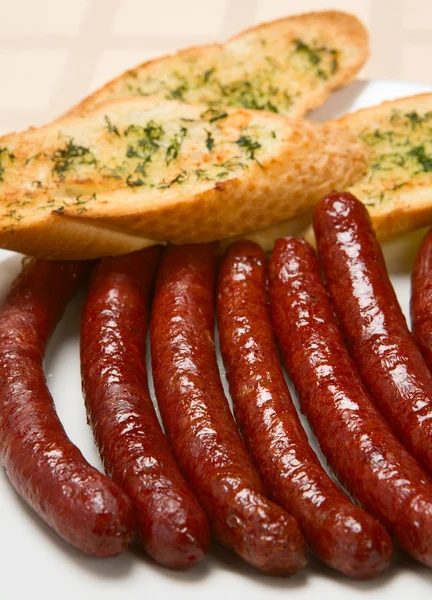 Grilled sausage on a plate — Stock Photo, Image