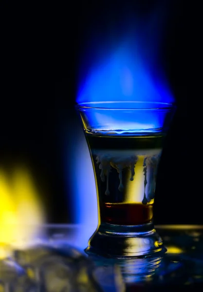 Cocktail with fire and an ice — Stock Photo, Image