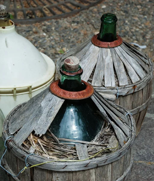 Old round wine bottles at flea market. Flask. — Stock Photo, Image