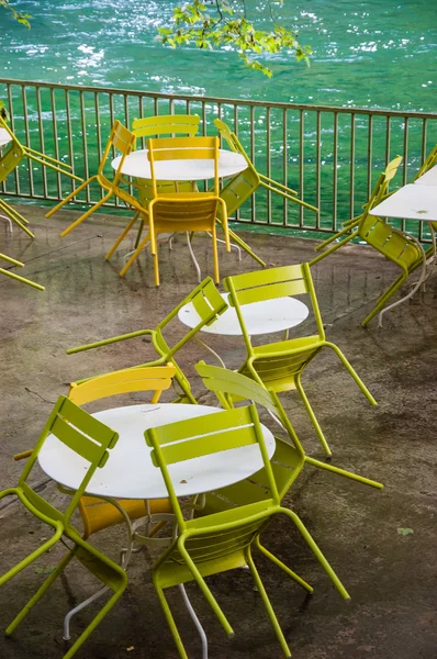 Tables and chairs with rain drops — Stock Photo, Image