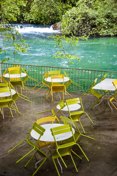 Tables and chairs with rain drops — Stock Photo, Image