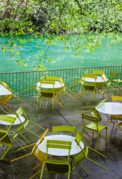 Tables and chairs with rain drops — Stock Photo, Image