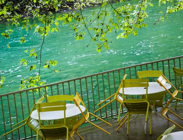 Tables and chairs with rain drops — Stock Photo, Image