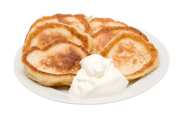 Fritters with sour cream — Stock Photo, Image