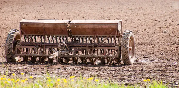 Old planter in the field — Stock Photo, Image