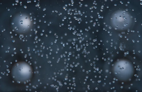 Background of falling water drops — Stock Photo, Image