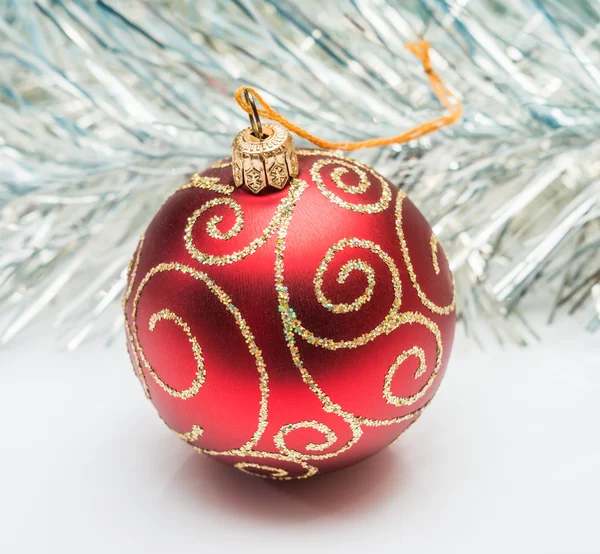 Christmas ball and tinsel — Stock Photo, Image