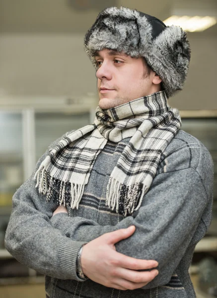 Man in a cap with earflaps — Stock Photo, Image