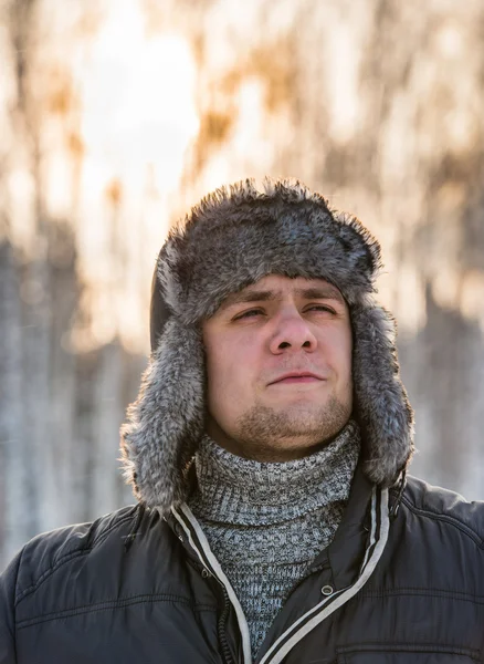 Man in a fur winter hat — Stock Photo, Image