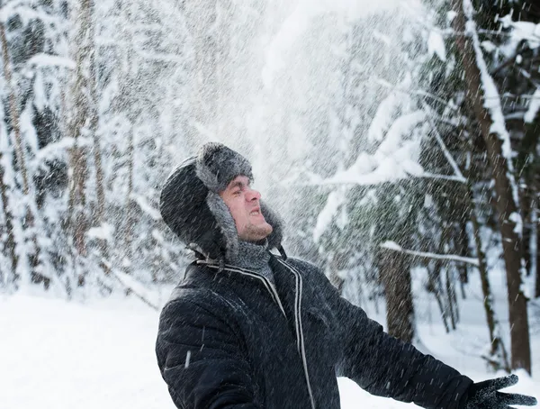 Man throws the snow — Stock Photo, Image