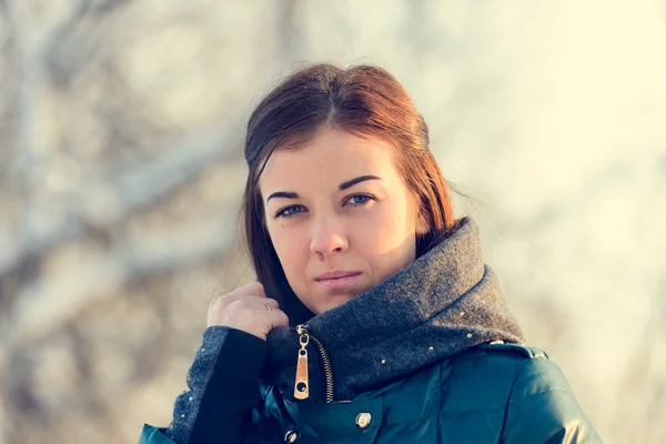 Portrait of young brunette girl in jacket — Stock Photo, Image