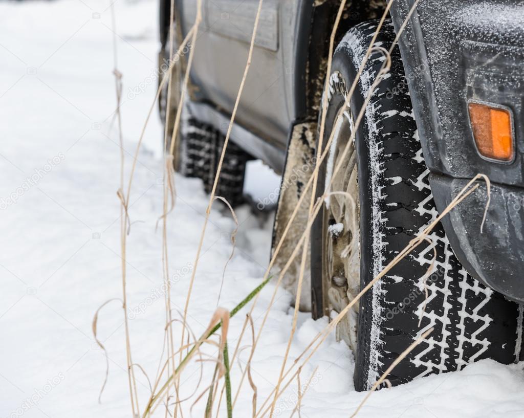 wheel in deep winter snow snowbank