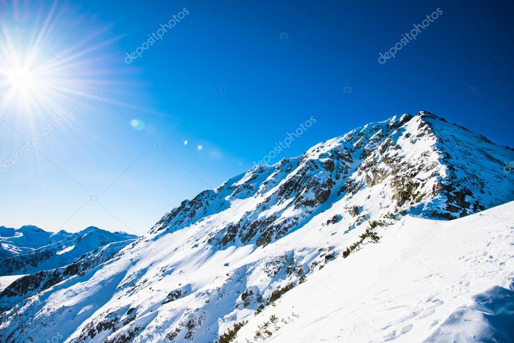 Winter mountain landscape against the blue sky. Peaks of Pirin M