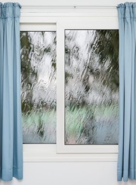 Closed window with curtains in rainy autumn weather clipart