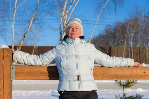 The woman of average years in a white knitted cap — Stock Photo, Image