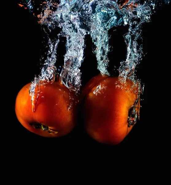 Tomato falling into water abstract — Stock Photo, Image
