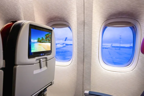 Una Cabina Avión Transatlántico Cómodo Sillón Con Televisor Ojo Buey — Foto de Stock