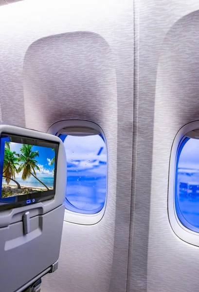 Eine Transatlantische Flugzeugkabine Ein Bequemer Sessel Mit Fernseher Und Bullauge — Stockfoto
