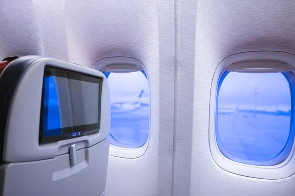 Una Cabina Avión Transatlántico Cómodo Sillón Con Televisor Ojo Buey — Foto de Stock