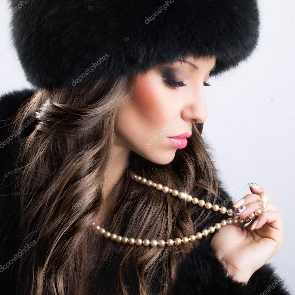 Beautiful woman in luxury fur