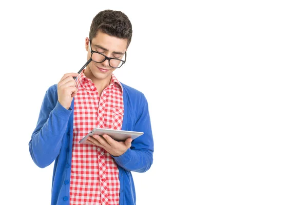 Fashionable nerd guy thinking and holding digital tablet — Stock Photo, Image