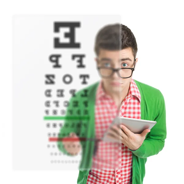 Young man checking his vision using hologram test — Stock Photo, Image