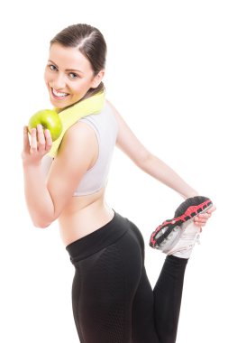 Fit young woman stretching out after workout clipart