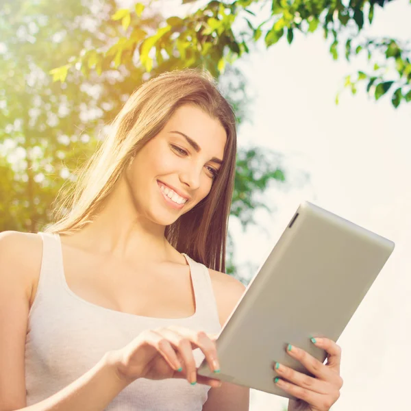 Cute girl with tablet computer — Stock Photo, Image