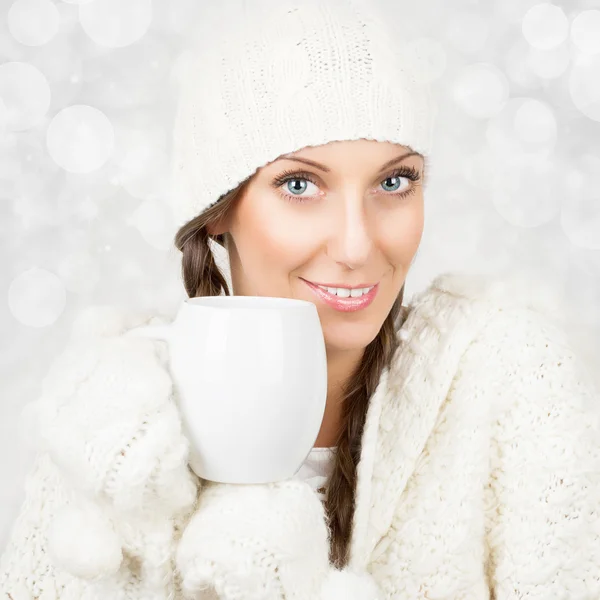Christmas girl in white drinking tea — Stock Photo, Image