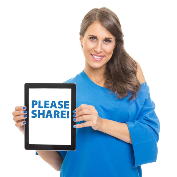 Young woman showing tablet computer that states please share — Stock Photo, Image