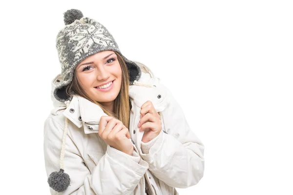 Beautiful teenage girl wearing winter jacket and knitted hat — Stock Photo, Image