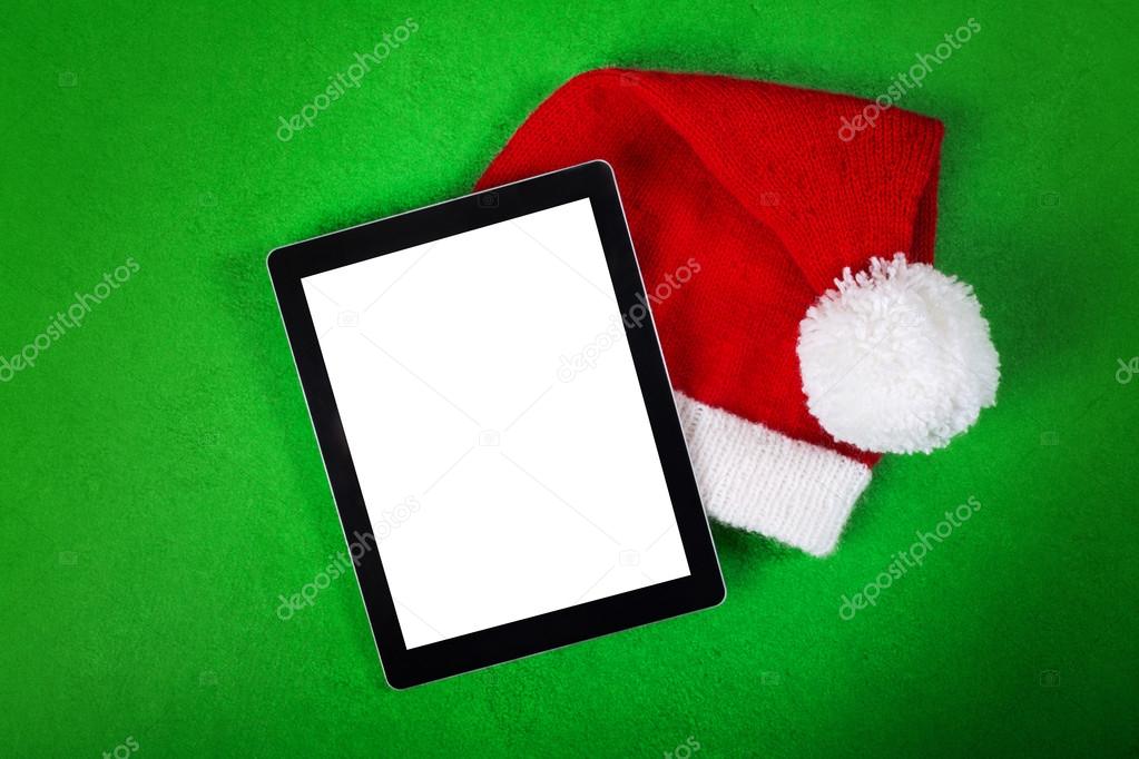 Blank tablet and Christmas Santa hat