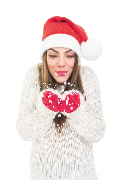 Happy beautiful Santa girl holding and blowing snow — Stock Photo, Image