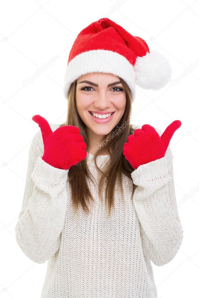 Excited young woman showing thumbs up