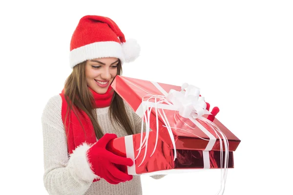 Happy young woman opening a gift — Stock Photo, Image