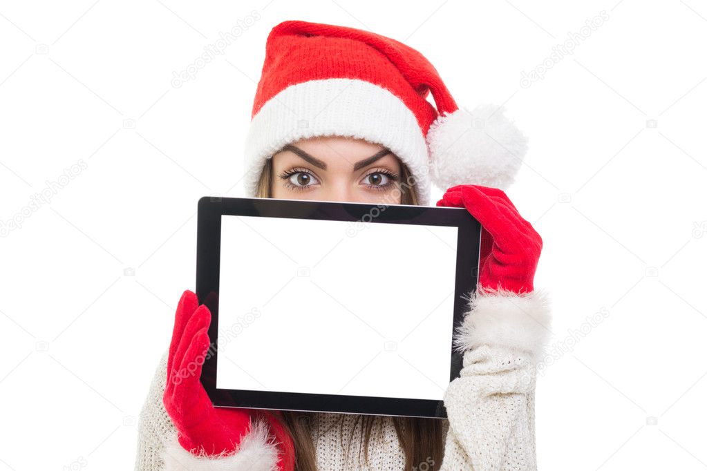 Cute Santa girl hiding behind tablet computer