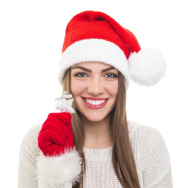 Cute Santa girl showing silver star Christmas decoration — Stock Photo, Image