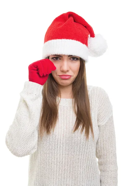 Triste jeune femme avec chapeau de Père Noël — Photo