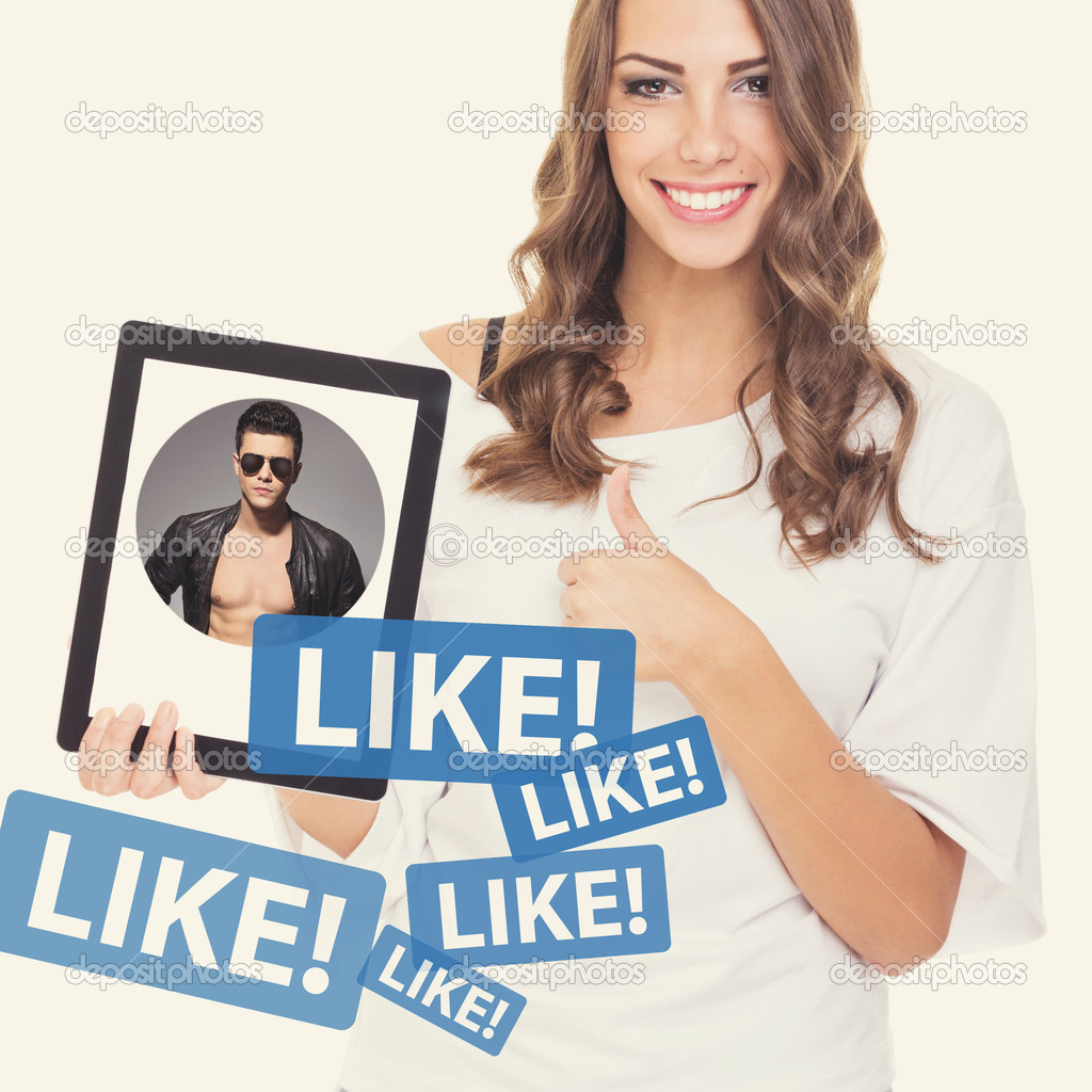 Beautiful teenage girl liking a handsome guy on social network