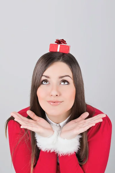 Cute young woman with small gift box — Stock Photo, Image