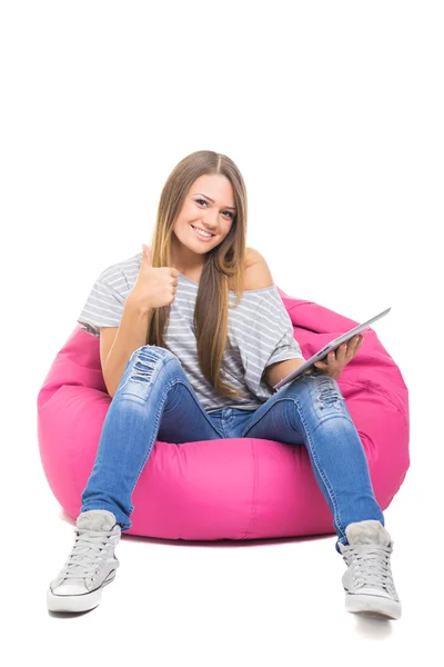 Cute teenage girl with tablet gesturing thumbs up — Stock Photo, Image