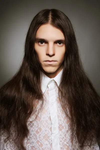 Old fashioned portrait of a long-haired boy over dark gray backg — Stock Photo, Image