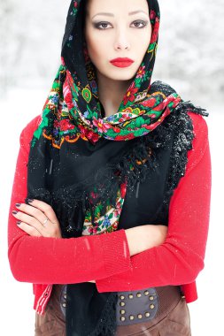 Winter girl in red cardigan with russian kerchief and luxury fas clipart