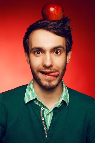 Portrait of a happy and mad student guy posing over red backgrou — Stock Photo, Image