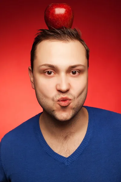 Portrait of a cheerful smiling student guy posing over red backg — Stock Photo, Image