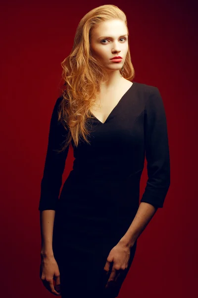 Portrait of a red-haired (ginger) fashionable model in a black c — Stock Photo, Image